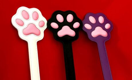 Alt: Pink Paw Print Leather Spanking Paddle Title: Cute Leather BDSM Paddle with Paw Design