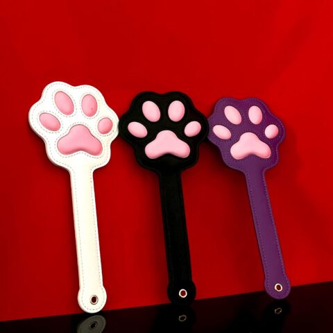 Alt: Pink Paw Print Leather Spanking Paddle Title: Cute Leather BDSM Paddle with Paw Design