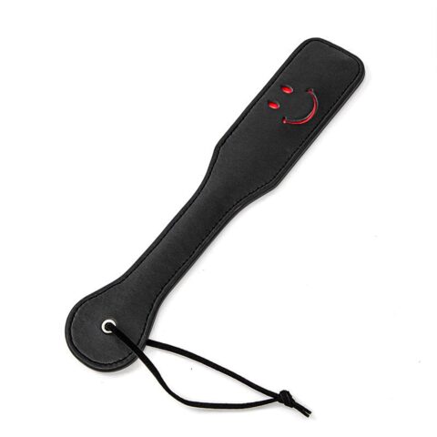 Smiley face spanking paddle with faux leather design